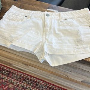 White denim shorts with distressing